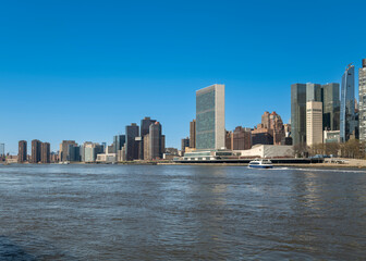  New York City skyscrapers on the river canal. High-quality photo