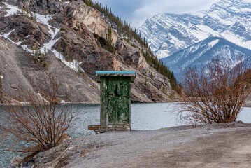 Whiteman’s Pond outhouse perched precariously on the edge of the pond in Kananaskis, Alberta