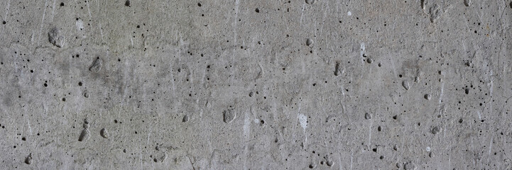 Texture of old concrete wall. Rough grey concrete surface. Wide panoramic background for design.