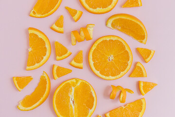 Organic Orange slices on a pink background