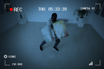 Thief in art gallery caught by surveillance camera - obrazy, fototapety, plakaty