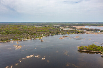 Georigian bay  drone photos with beaches and islands  by waubaushene beach going into lake huron with clouds and blue skies 