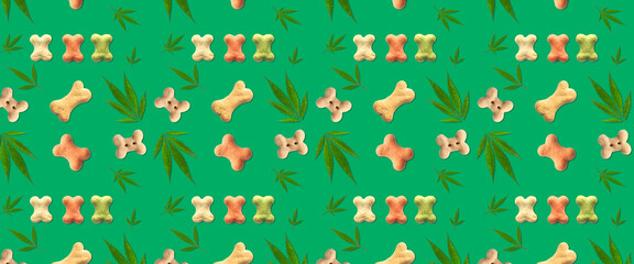 Dry pet food with hemp leaves on green background