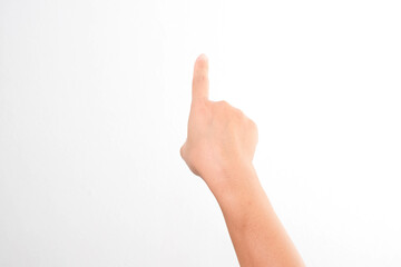 Female hands pointing at something or touching virtual screen on white background, closeup. Hand simulating pressing a button.