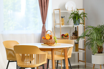 Interior of dining room with table and wicker fruit basket