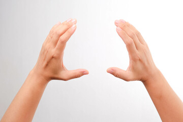 Female hand gesture holding something isolated on white background.