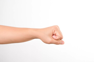 Hands clenched fists isolated on a white background. Close-up of female hand reaching out with a clenched fist.