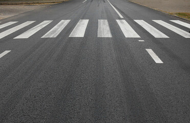 Zebra crosswalk on road in city