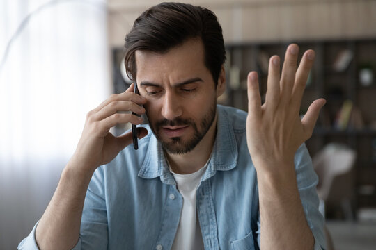 Professional Misfortune. Troubled Casual Businessman Call Boss Partner Discuss Business Failure Ask For Advice In Difficult Situation. Unhappy Young Male Share Personal Problems With Friend By Phone