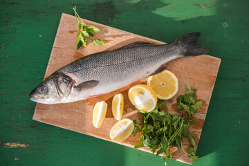 sibas fish wit Ingredients for cooking or grill on cutting board. Top view, copy space