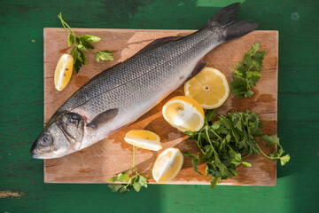 sibas fish wit Ingredients for cooking or grill on cutting board. Top view, copy space
