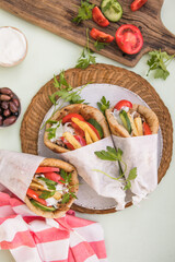 Greek chicken souvlaki ona pita with fresh vegetables with tzatziki sauce