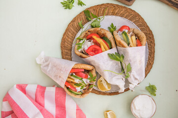 Greek chicken souvlaki ona pita with fresh vegetables with tzatziki sauce