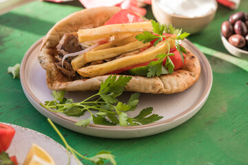 Greek chicken souvlaki ona pita with fresh vegetables with tzatziki sauce