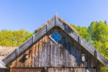 Gable on a old wooden farmhouse with a window