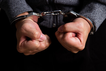 Arrested Man's Hand With Handcuffs