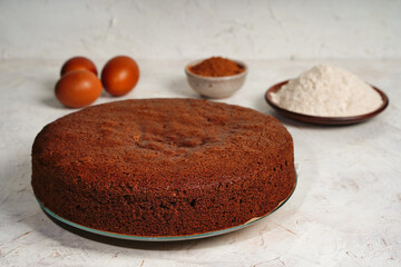 A round chocolate sponge cake or chiffon cake so soft and delicious with ingredients: eggs, flour