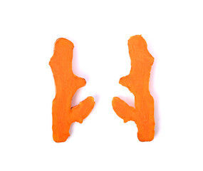 Half of turmeric roots on white background. Top view