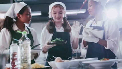 Group of schoolgirls having fun learning to cook. Female students in a cooking class.
