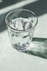 Gin tonic alcoholic cocktail drink with dry gin, bitter tonic, lemon juice. Wooden table background with copy space