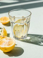 Gin tonic alcoholic cocktail drink with dry gin, bitter tonic, lemon juice. Wooden table background with copy space