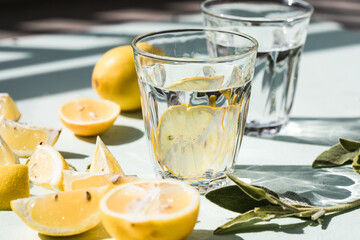 Gin tonic alcoholic cocktail drink with dry gin, bitter tonic, lemon juice. Wooden table background with copy space