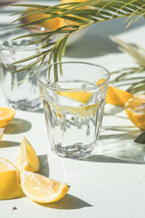 Gin tonic alcoholic cocktail drink with dry gin, bitter tonic, lemon juice. Wooden table background with copy space