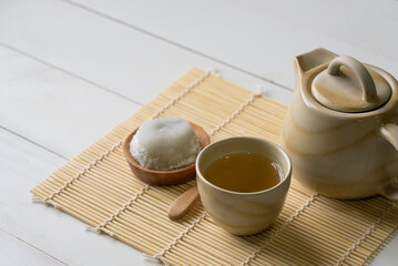 Hot Green Tea Served With Daifuku on Table in Restaurant. Japanese Food Concept