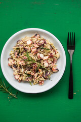 fresh and tasty true Greek kritharaki with octopus