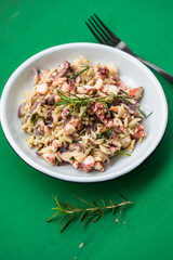 fresh and tasty true Greek kritharaki with octopus