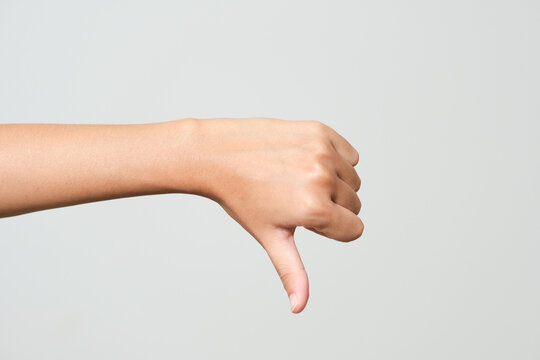 focus of woman showing thumb down isolated on white
