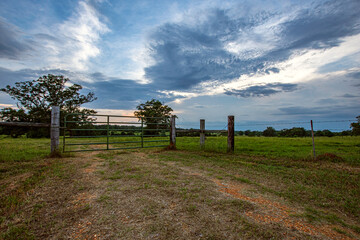 Pasture gate with dramatic sky