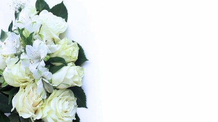 White roses on a white background. A festive bouquet. Background for a greeting card.