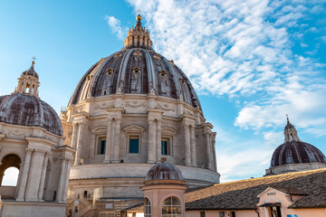 Fototapeta na wymiar Detailed close up view on Michelangelos Dome of St Peter Basilica in Vatican City, Rome, Lazio, Europe, EU. Architectural masterpiece of Papal Basilica of Saint Peter. Church sightseeing on sunny day