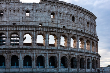 Fototapeta premium Panoramic view on exterior facade of famous Colosseum (Coloseo) of city of Rome, Lazio, Italy, Europe. UNESCO World Heritage Site. Flavian Amphitheater of ancient Roman Empire. Concept tourism