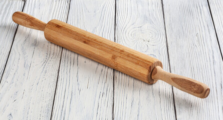 Rolling pin on white wooden table