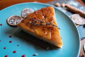 slicing fresh cheese or peer cake with mousse and cream and caramel crust