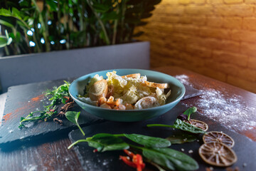 fresh and delicious caesar shrimp salad with lettuce and crusty crouton toasts