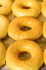 Tasty donuts with jam on wooden background - Hanukkah celebration concept