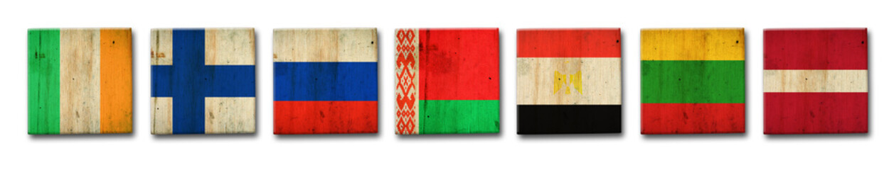 Set, Ireland, Sweden, Russia, Belarus, Egypt, Lithuania, and Latvia flags on a wooden block. Isolated on white background. Signs and symbols