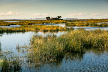 The floating village of Uros on Lake Titicaca, Peru. Lake Titicaca is the largest lake in South America and the highest navigable lake in the world.