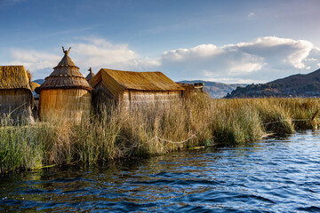 The floating village of Uros on Lake Titicaca, Peru. Lake Titicaca is the largest lake in South America and the highest navigable lake in the world.