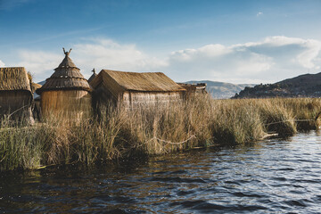 The floating village of Uros on Lake Titicaca, Peru. Lake Titicaca is the largest lake in South America and the highest navigable lake in the world.