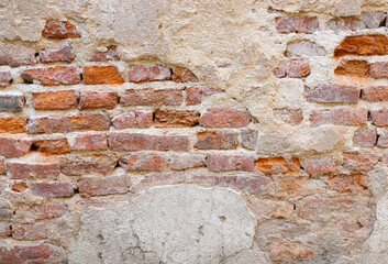 red brick block wall texture old background ancient weathered brick wall with cracks and destroyed stucco layer with copy space