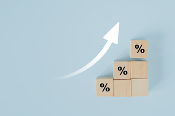 percentage sign on wooden cube blocks and up arrow on blue background for  financial and business growth interest rates and mortgage rates interest on investment inflation concept - obrazy, fototapety, plakaty
