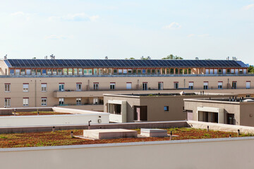 Solar Panels on Roof of High-rise Buildings . Solar Panels Roof House. Modern apartment building with solar station. © Maryana