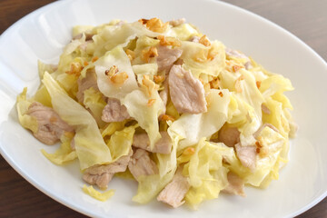 Cabbage and Pork Stir Fry on a white plate.