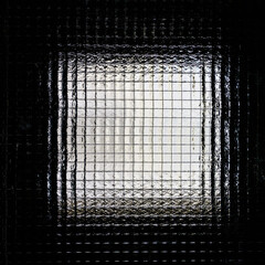 Texture. Reinforced glass with a wire grille