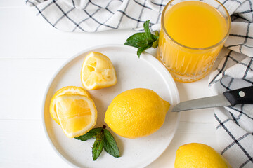 fresh lemon juice with mint in a glass on the table