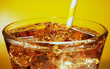 Glass of cola with ice cubes.